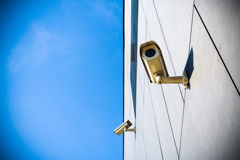 Security camera over blue sky